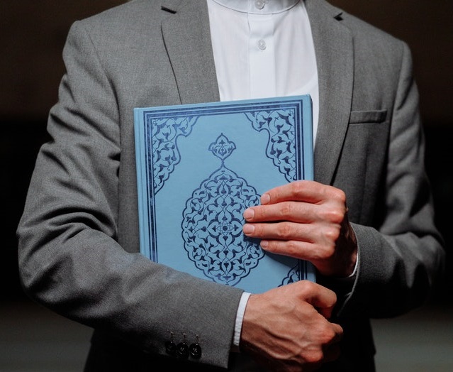 A picture containing person, person, suit, maleDescription automatically generated