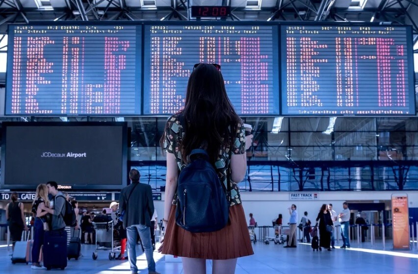 A picture containing text, person, walkingDescription automatically generated